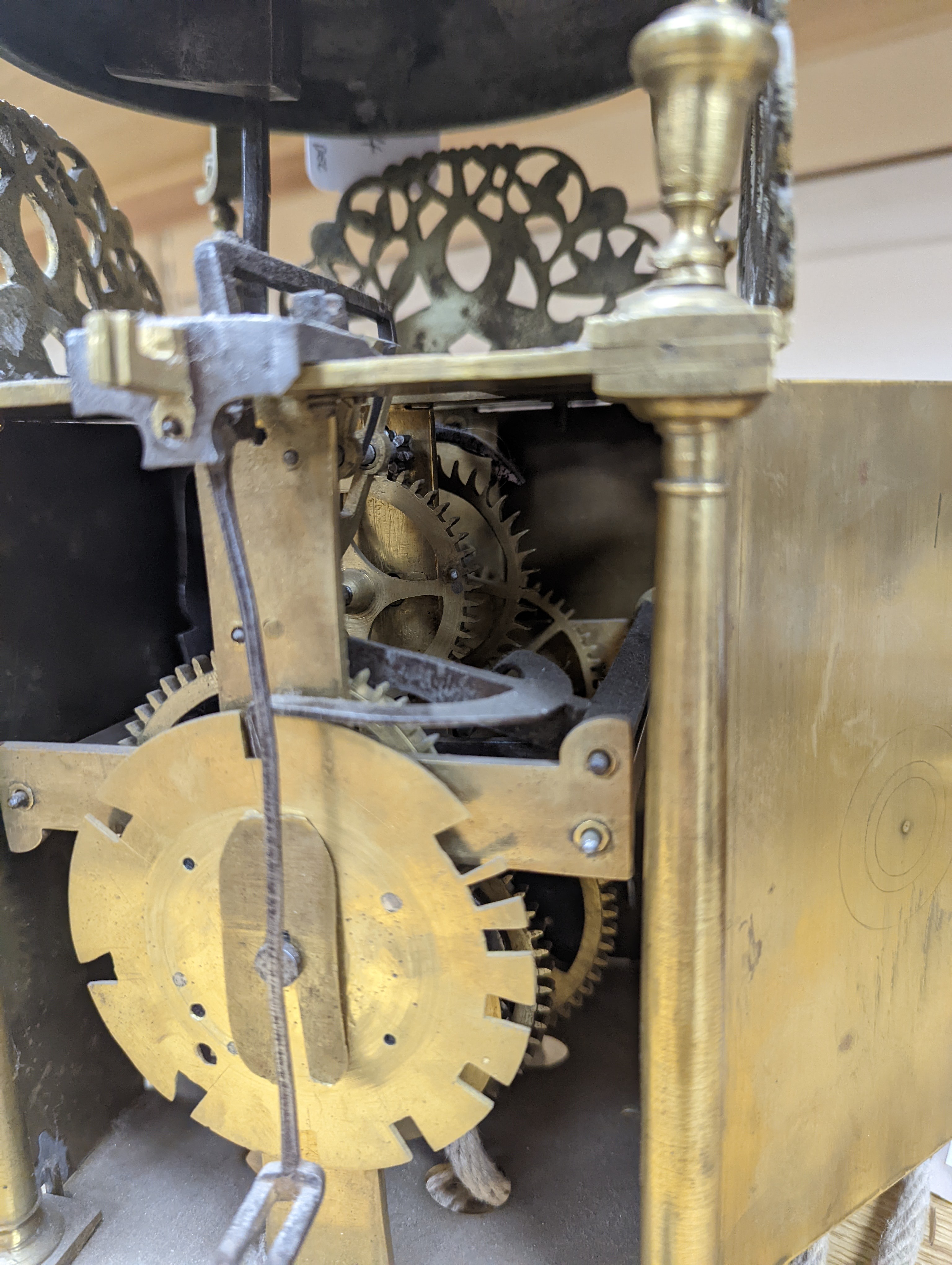 A 17th century style brass lantern clock width 15cm depth 15cm height 40cm